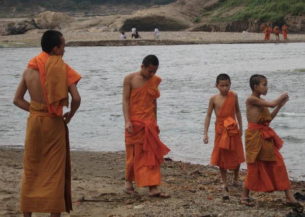 Novice Monks playing by river