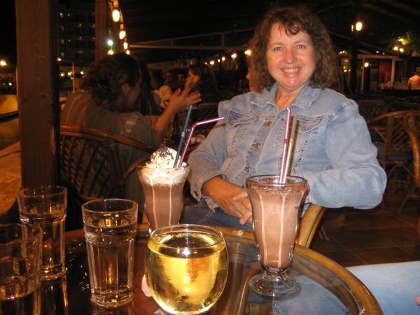 Arlene having a drink at a Rafina outdoor restaurant