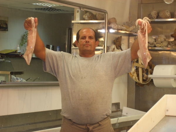 A proud fish market owner