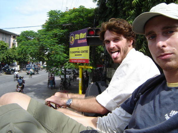 Riding on the top of a pick-up truck in Mandalay