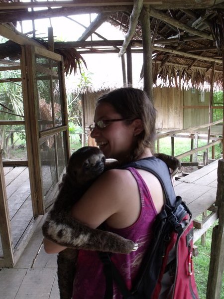 Sara hugging a three toed sloth...