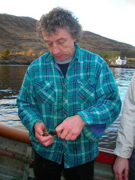 Neil opening a scallop