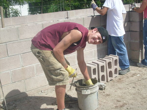 Chris scooping concrete