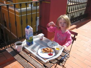 Camille having arooftop breakfast in Sevilla