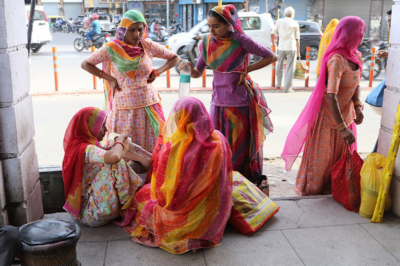 Colourfully dressed shoppers