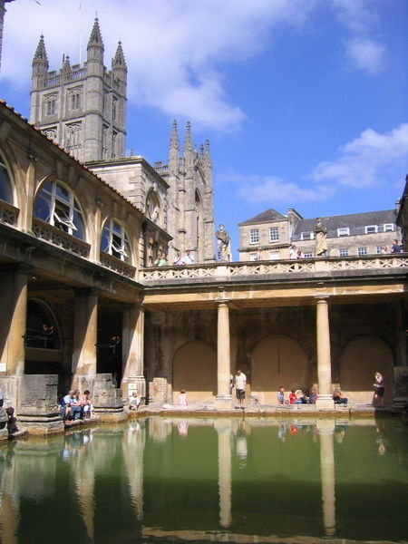 The Great Bath, in the Roman Baths, with a view of the Abbey behind
