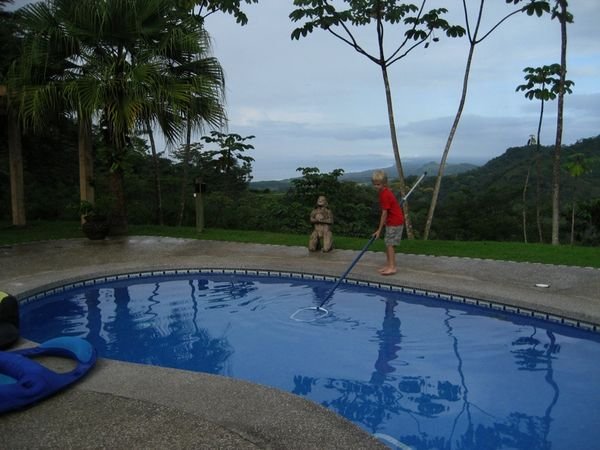 Sam keeping the pool clean - note the amazing view behind him