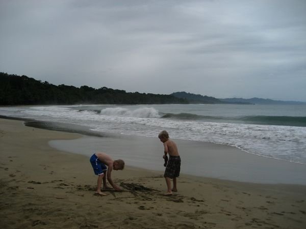 Kyle and Sam doing some sand castle construction at Punta Uva