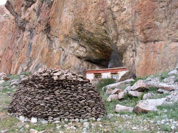 cave home and dung pile