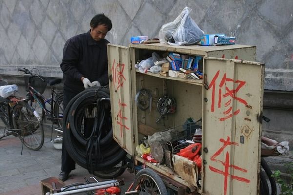 Street side bicycle repair man