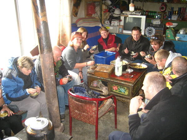 We take over a womans living room. She let us cook ourselves some lunch, noodle soup made by Ting Ting our chinese guide.