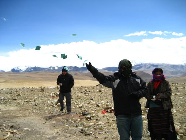 Tommy throws some prayer flags into the wind for good karma