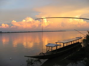 The sun sets over the Mekong at Champasak