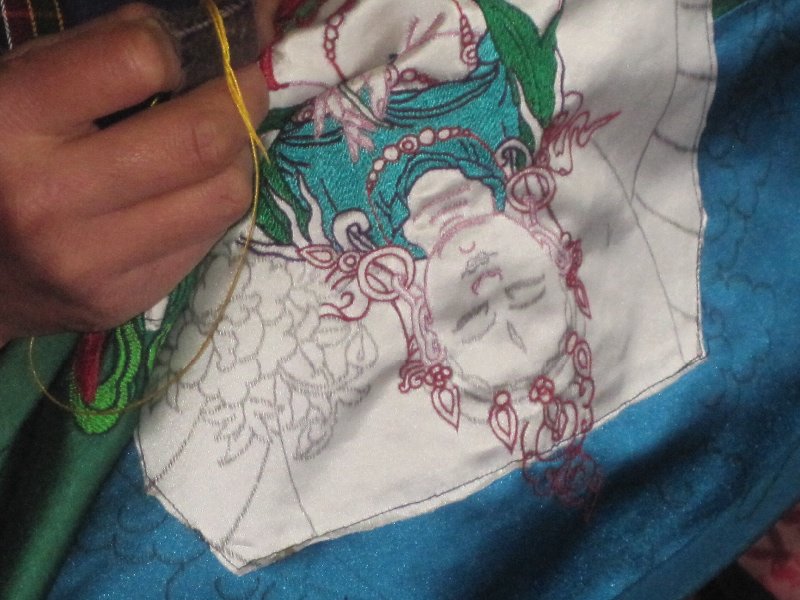 Embroidered image of Buddha