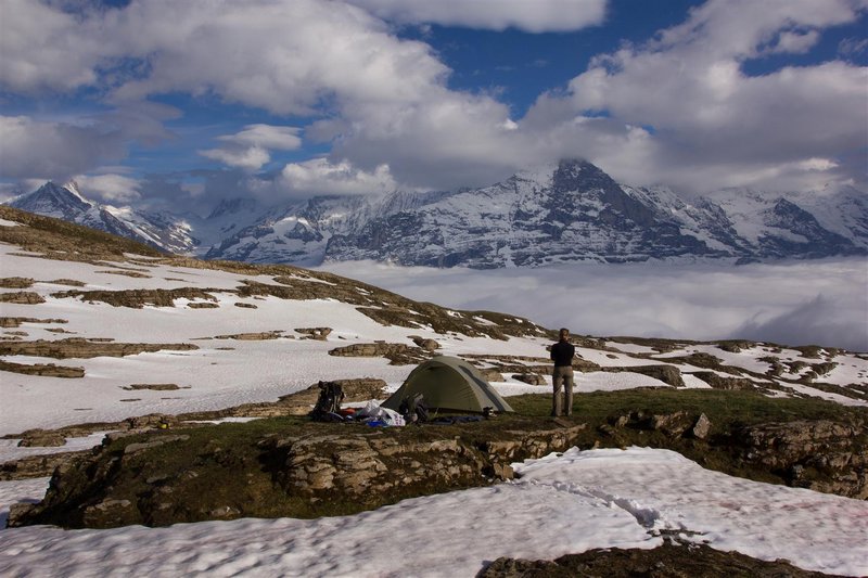 Bivy above the clouds with perfect view on Eiger(3668m), Monch (4107m) and Jungfrau (4158m)