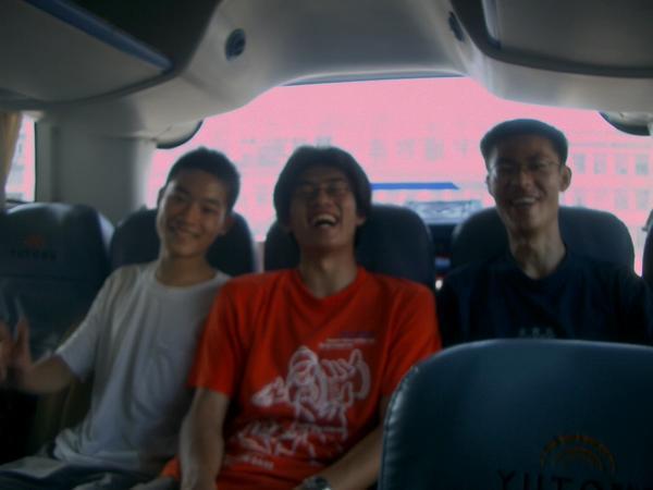 Three boys on a bus
