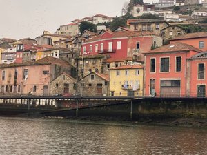 View of colorful buildings from the boat in Porto