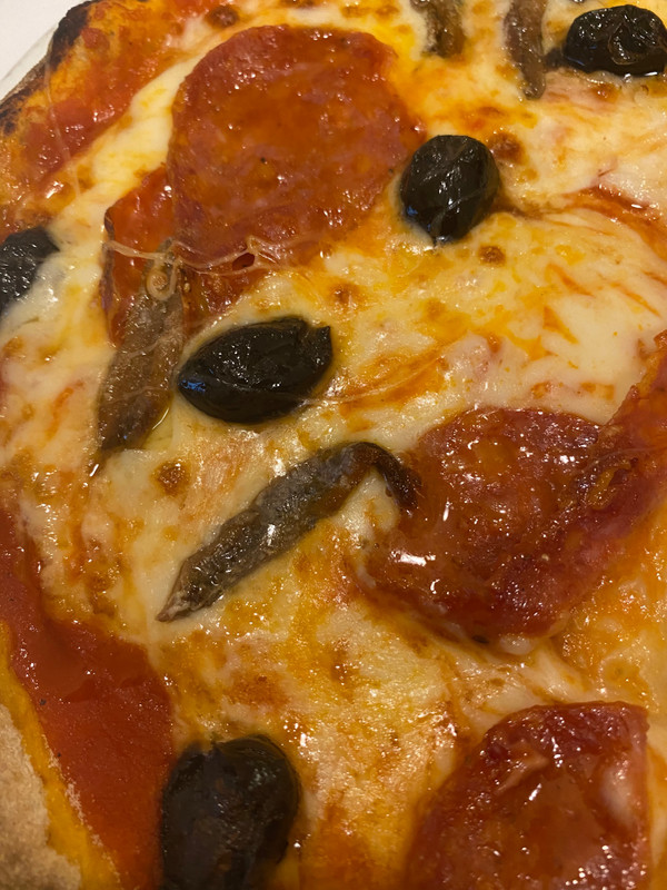 Pizza with fresh anchovies.