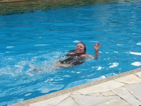 MJ swimming in the hotel pool