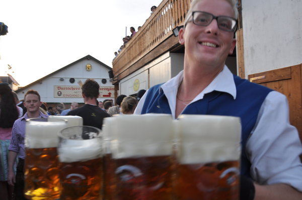 Waiter carrying 14 beers