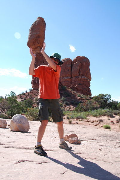 Joe holding balanced rock