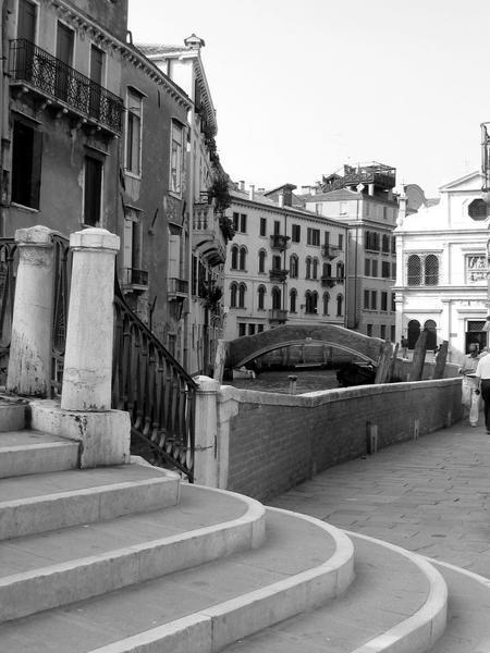 Steps leading over many of the canals of Venice, perceptual layers of architecture and distances...and never quite knowing where you are. Yet.