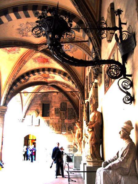 The Bargello courtyard. 15th century iron lamp. 