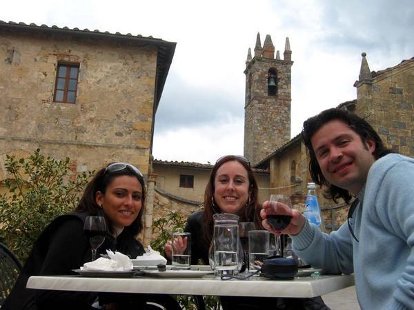 Salima, Riccardo and I snacking in the main, and only, piazza. Chiesa Santa Maria in the background.