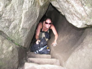 Climbing through the cave.