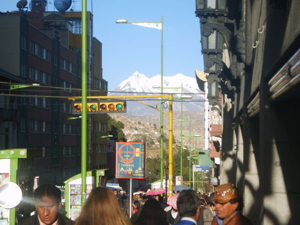 busy st in la paz with mountain looming