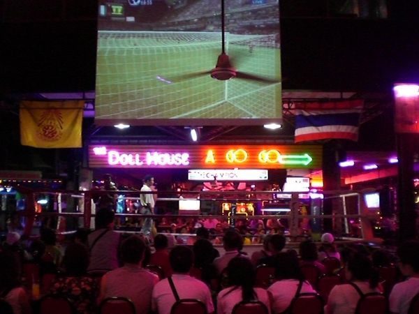 Thai Boxing, football, and a neon sight to the nearest sleaze bar..... no wonder its packed!