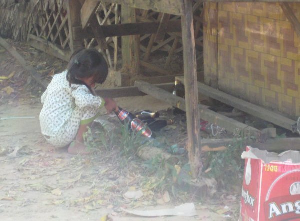 Out in Banteay Srei; a little girl playing