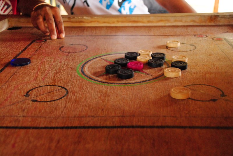 Carrom - a snooker like game played with the fingers