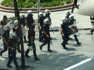 Police with gas masks donned
