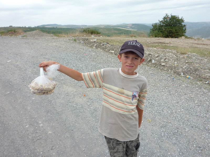 Young Kids selling nuts on the roadside