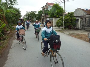 Children cycling home from school