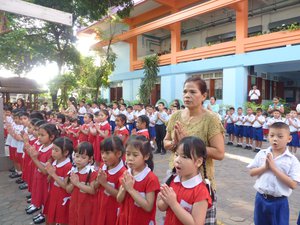Children singing the national anthem