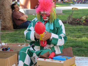 Clown making balloon figures