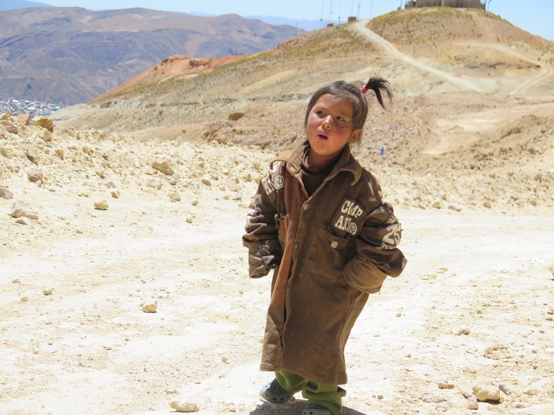 Little girl who lives with her mother outside of the mine