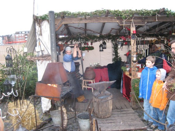 A blacksmith at the Medieval market