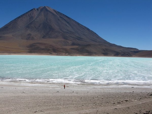 Day 2: Will on the shores of Laguna Verde, towered over by Volcano Licancabur 