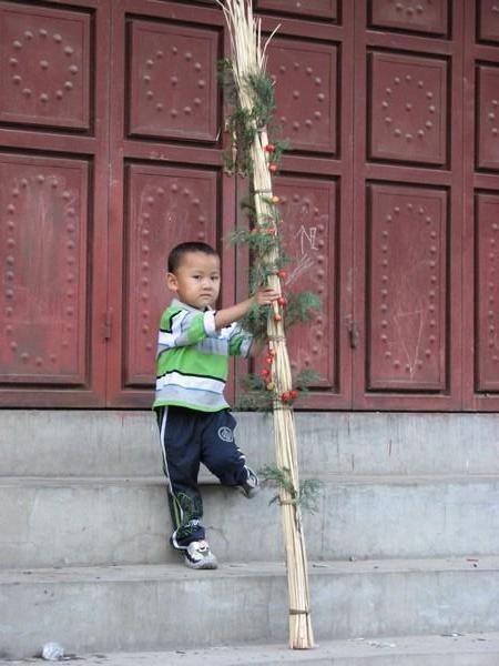 Young boy prepares for the Torch festival