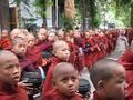 Young monks lining up to receive their food