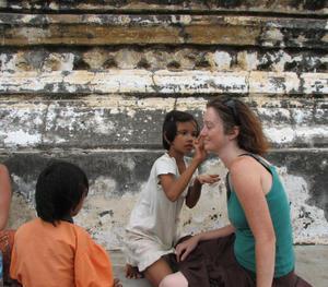 Having my face painted at the top of Shwesandaw Paya