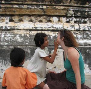 Having my face painted at the top of Shwesandaw Paya