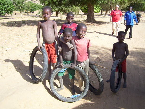 The cutest kids playing with tires