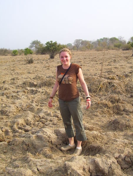 standing in dried elephant footprints from the rainy season