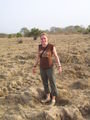 standing in dried elephant footprints from the rainy season