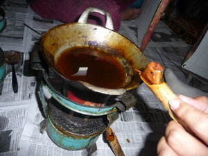 Boiling hot bees wax for making batik