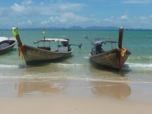A few picturesque long tail boats
